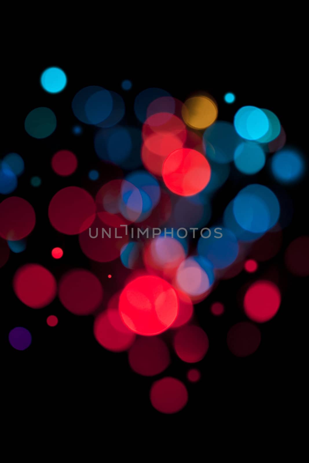 Background defocused colored  lights. Not photoshop.
