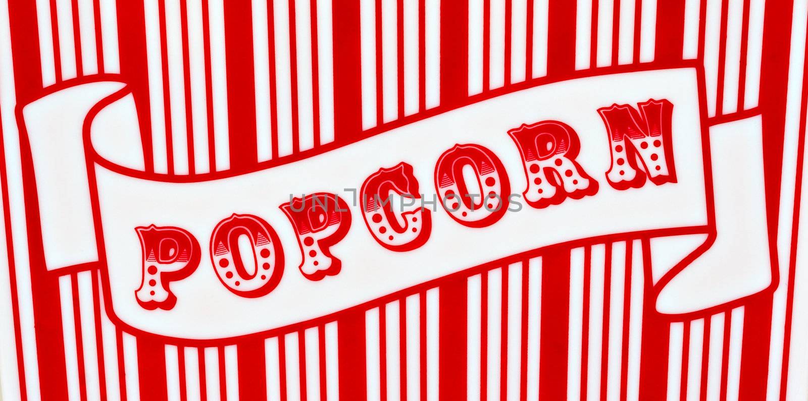 Red and white popcorn sign on red and white striped background