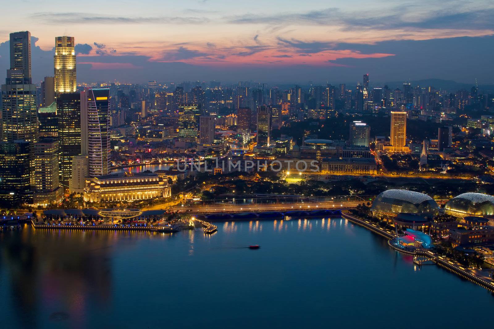 Singapore Skyline and Marina Bay Esplanade by River at Sunset