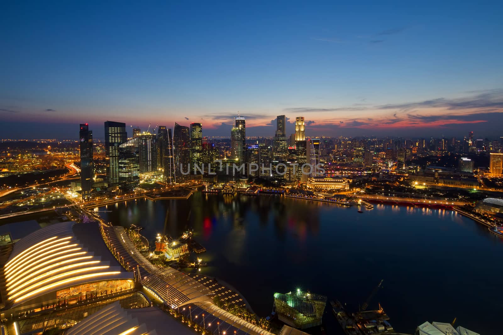 Singapore Central Business District Skyline by River at Blue Hour