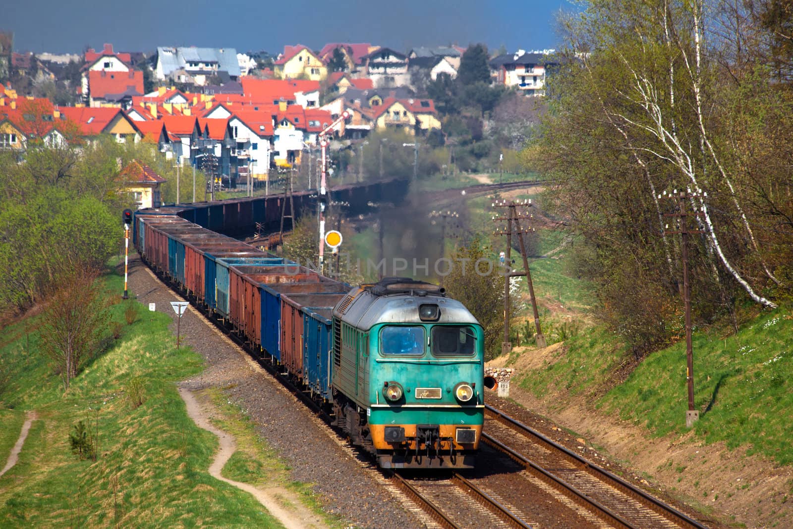 Freight train passing the hilly landscape
