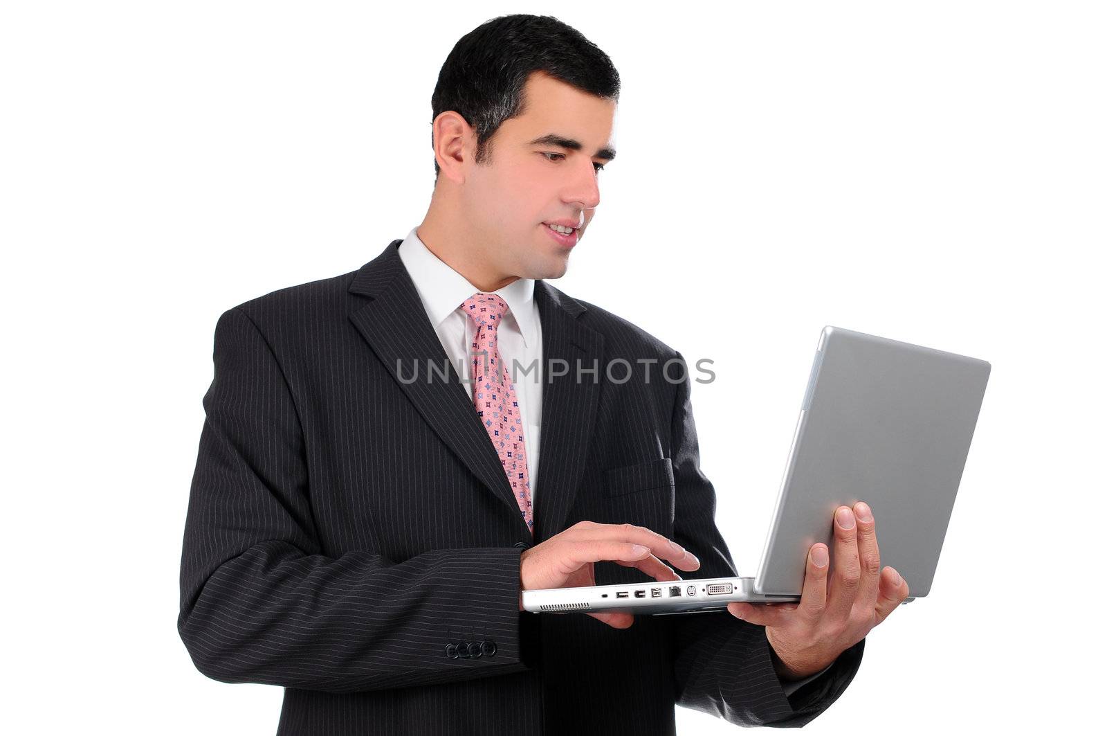 Close up of young businessman holding laptop