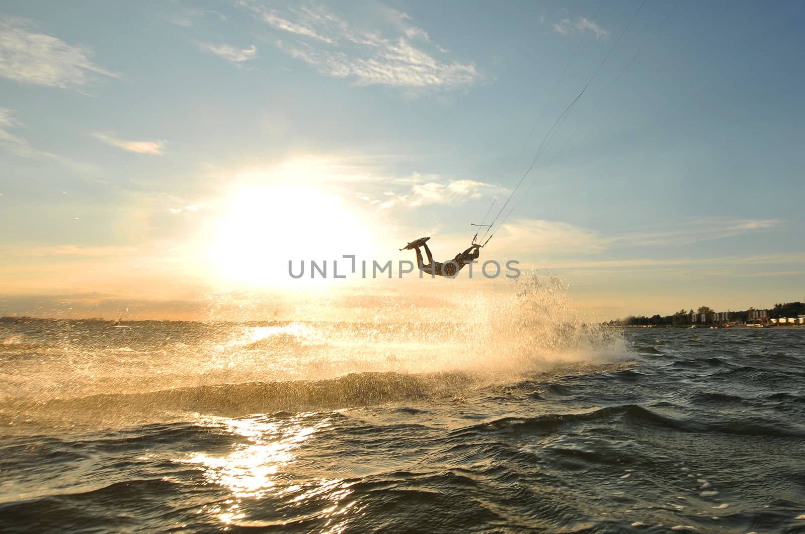 Portrait of a kiteboarder before sunset
