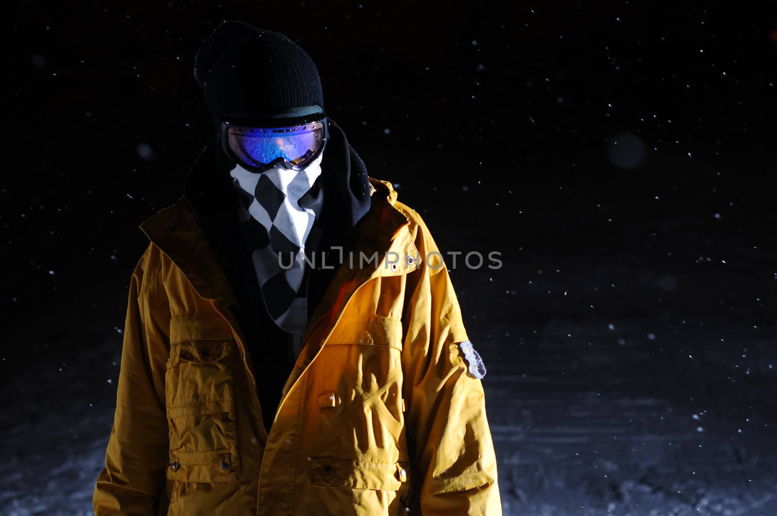 Portrait of a snowboarder standing at night by gravityimaging1