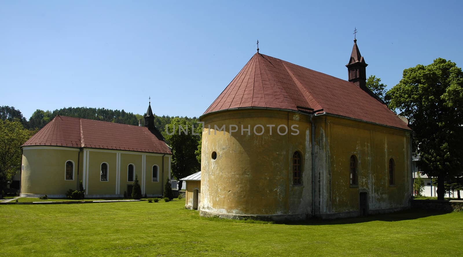 old chapels in Svidnik, Slovakia;
clear blue sky, green grass