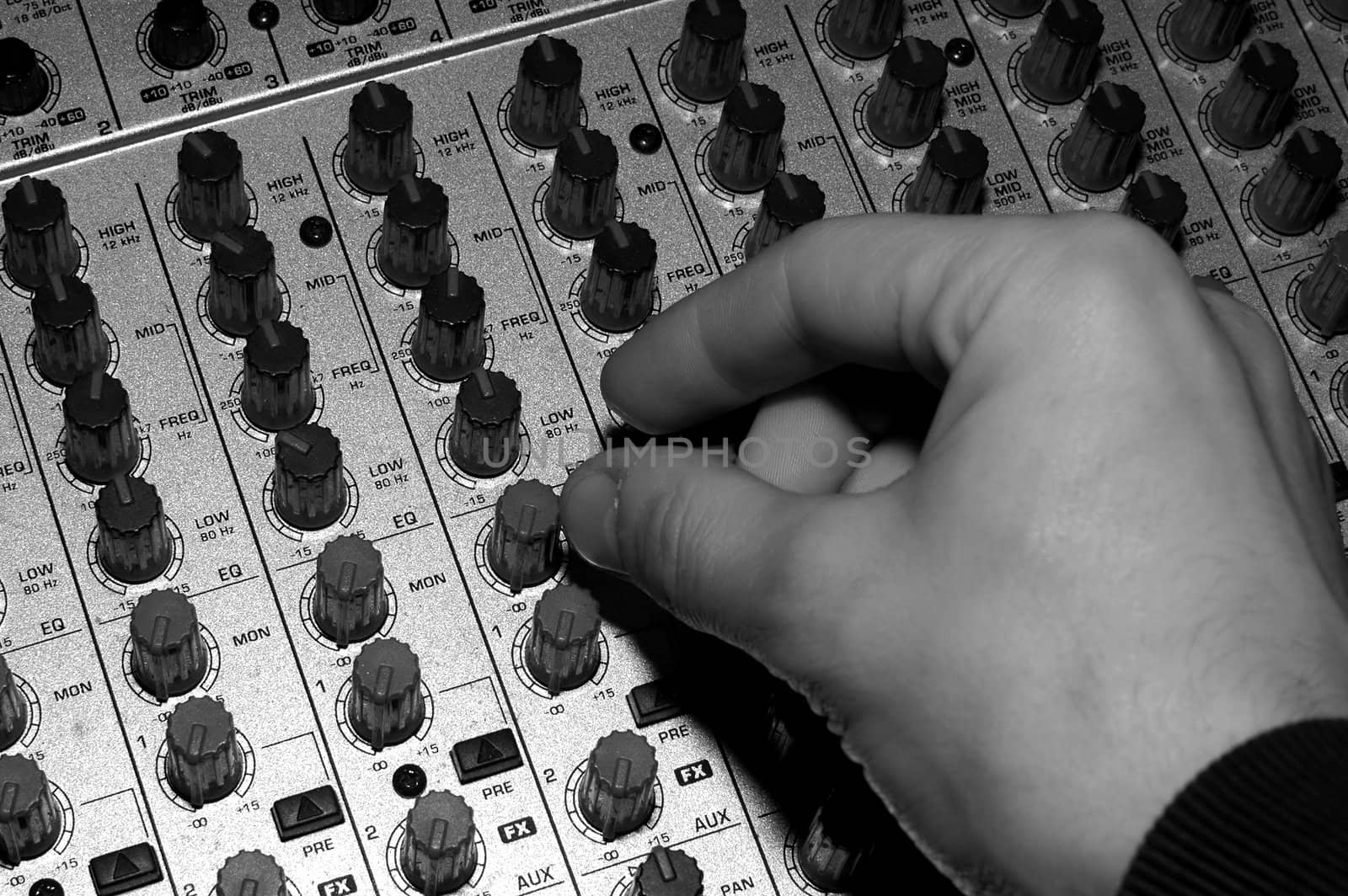 audio mixing device, human hand, black and white photo 