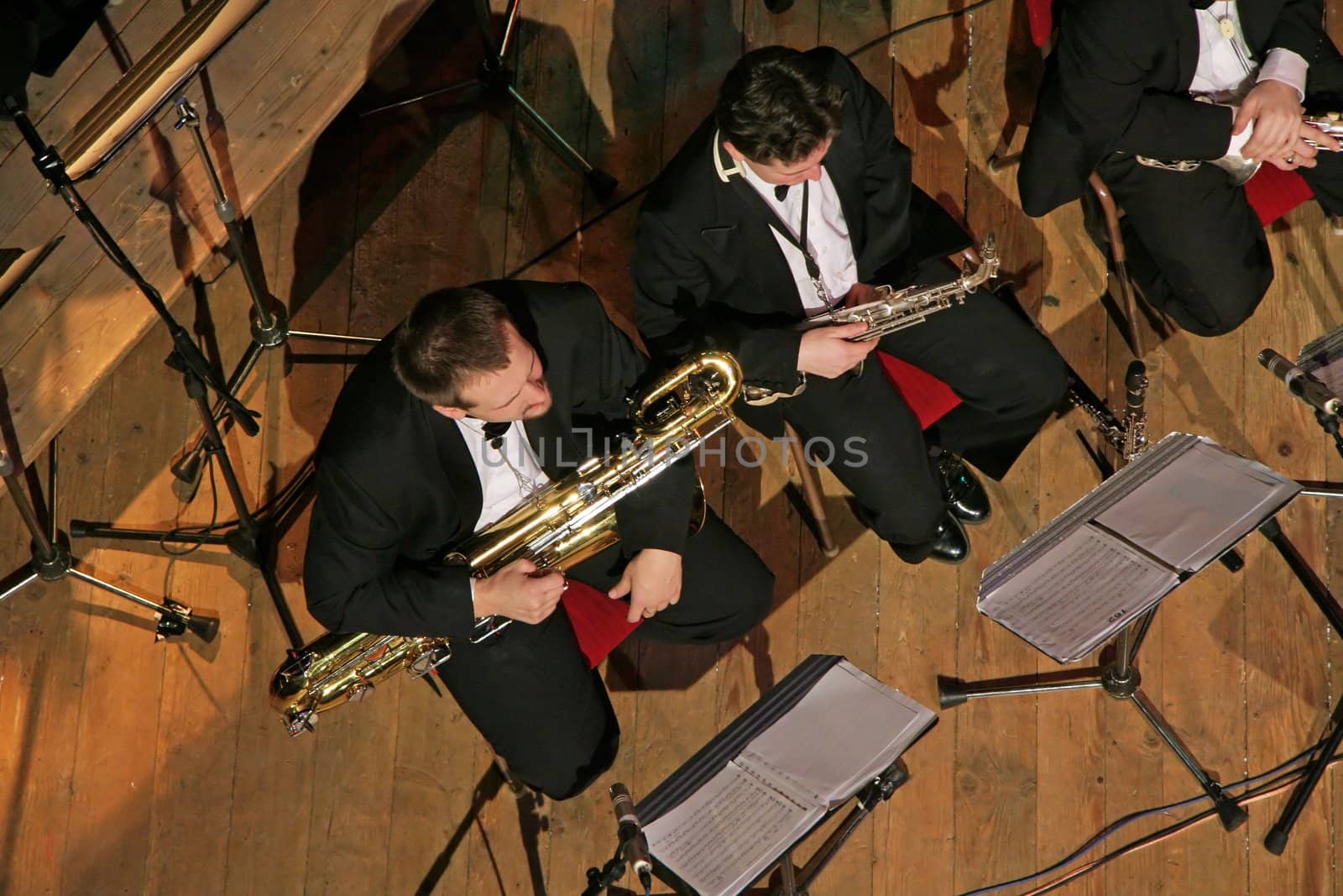 members of orchestra, sitting and waiting, birds perspective