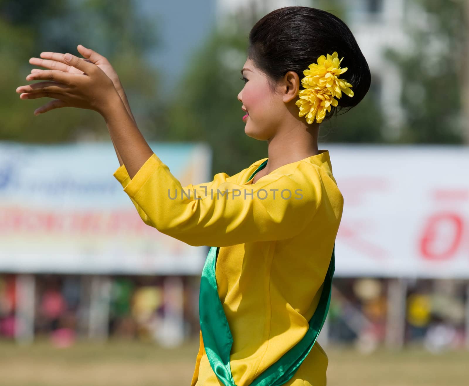 SURIN - NOVEMBER 21: Dancer in traditional silk outfits during The Annual Elephant Roundup on November 21, 2010 in Surin, Thailand.