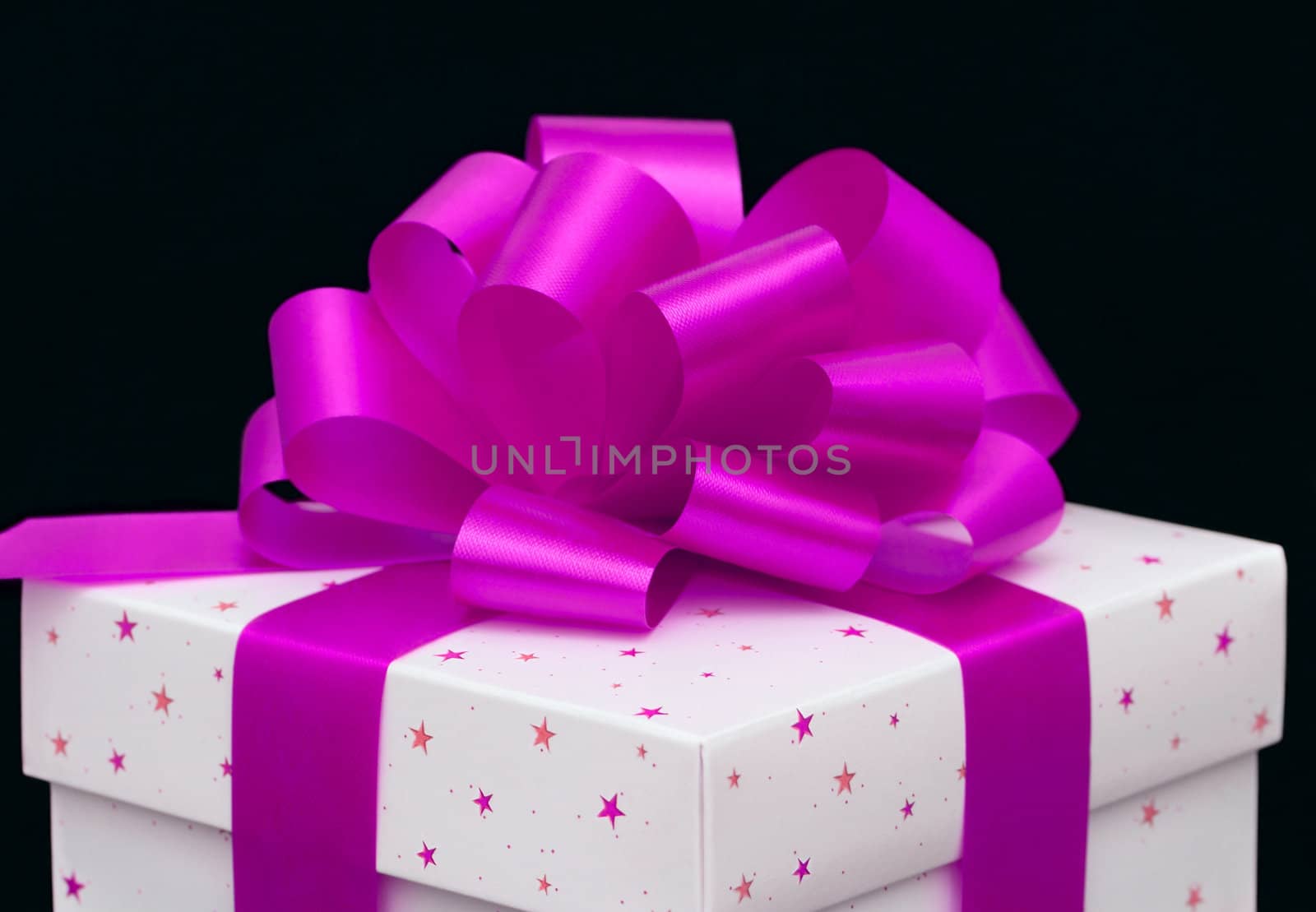 White gift box isolated on black