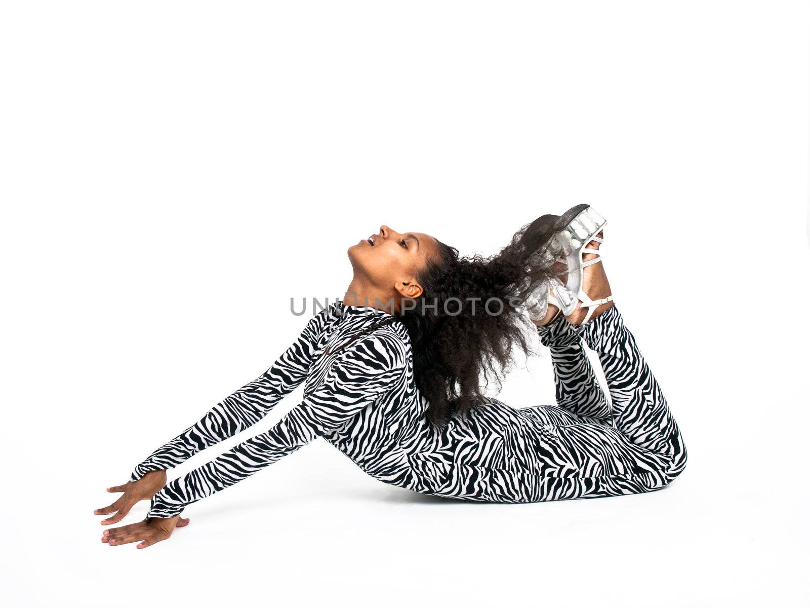African dancer in a zebra suit in a dance pose