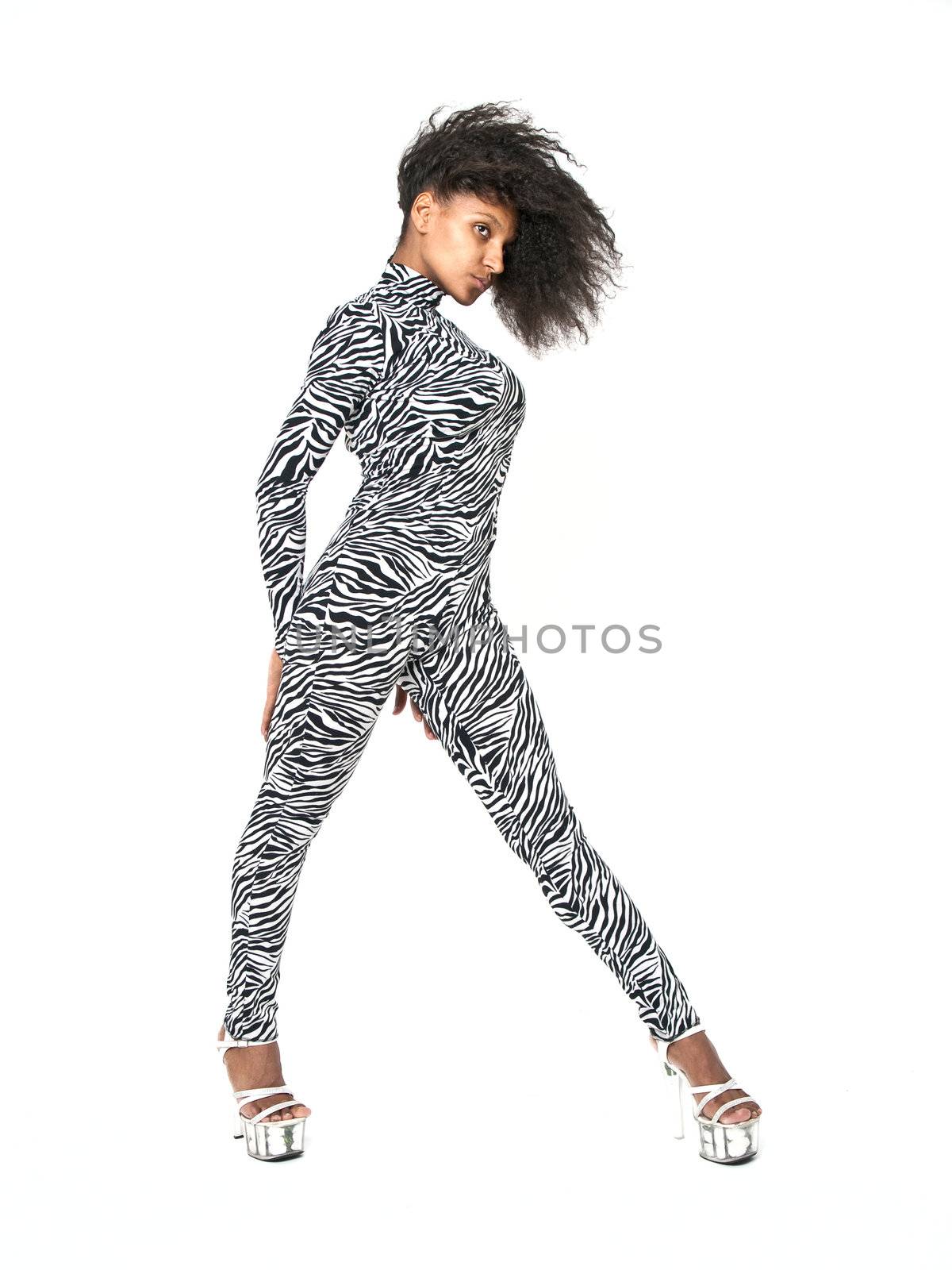 African dancer in a zebra suit in a dance pose