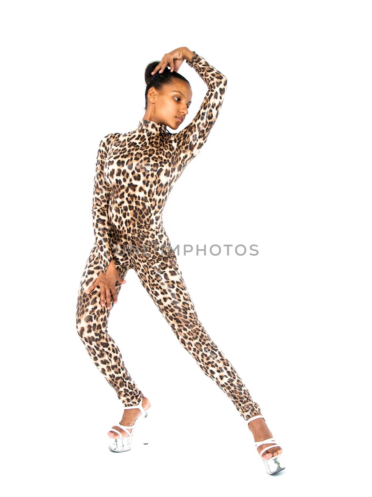 African dancer in leopard suit striking a dance pose