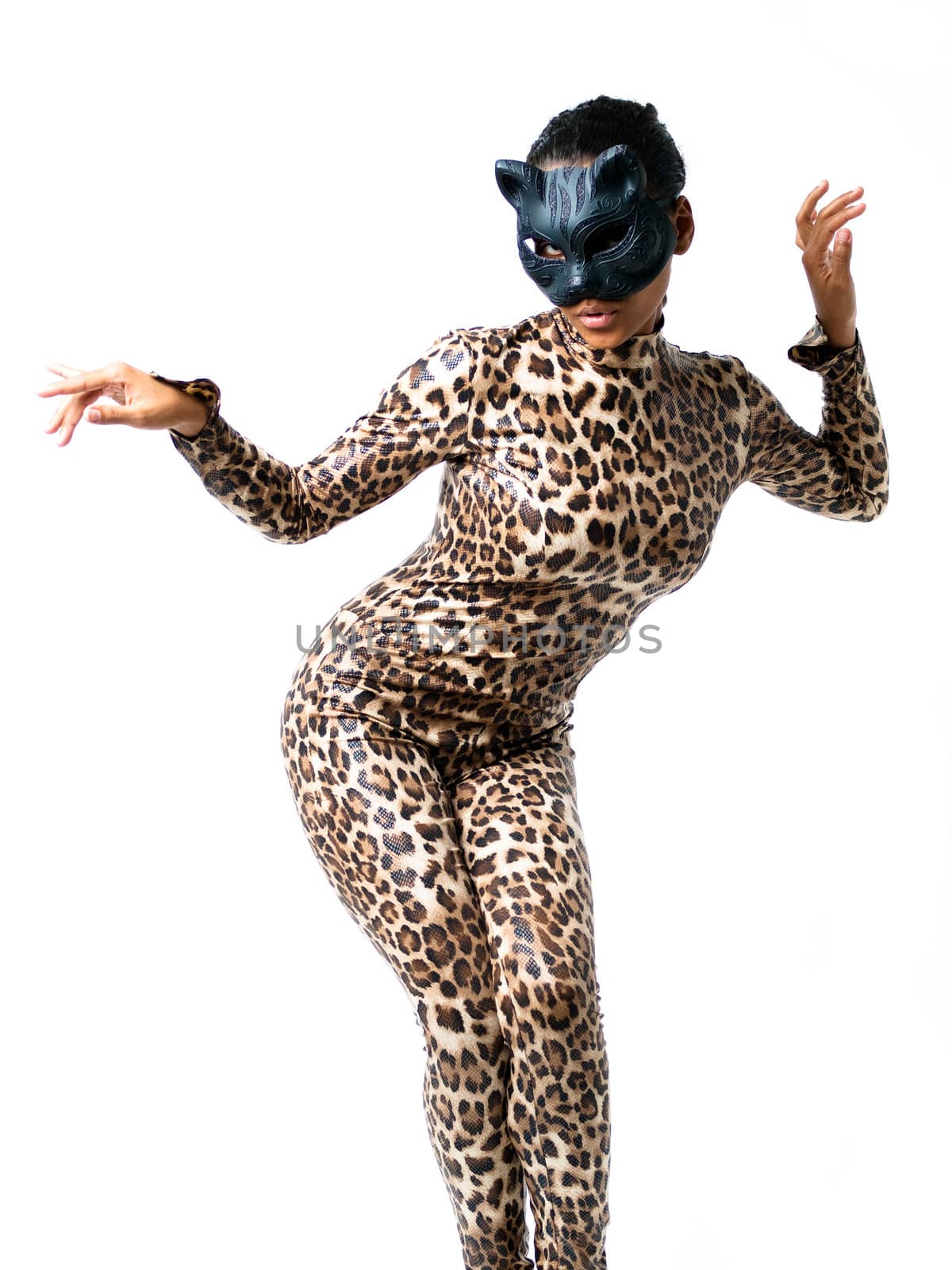 African dancer in leopard suit striking a dance pose wearing a cat mask