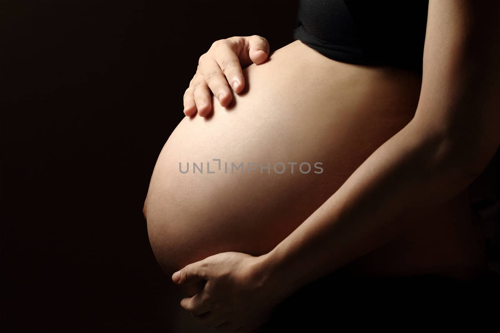 body of a 9-month pregnant woman