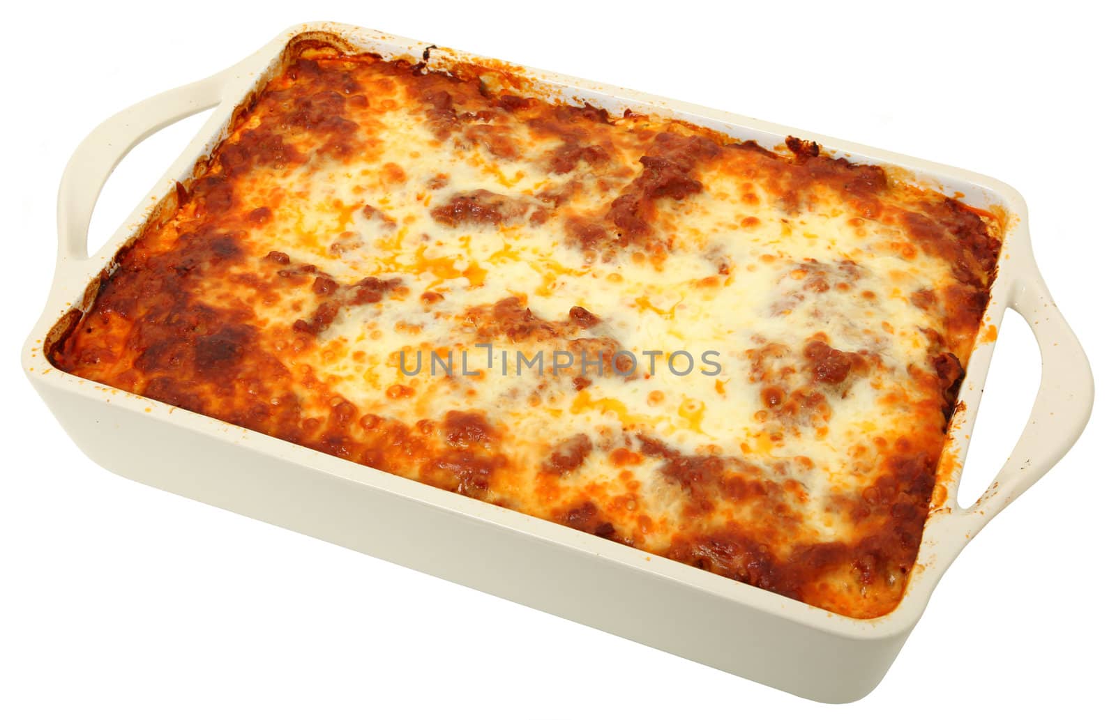 Lasagna uncut in baking dish over white background.