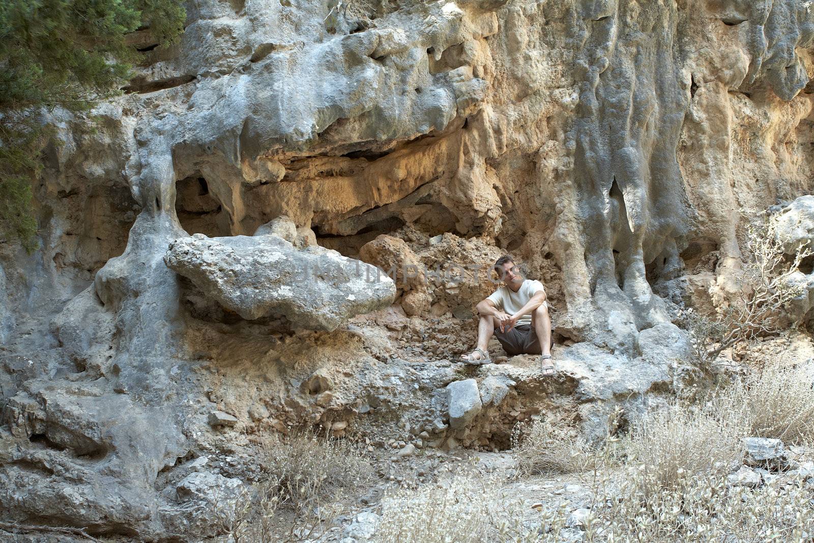 A rock climber have a rest in the Greece Mountain. Crete