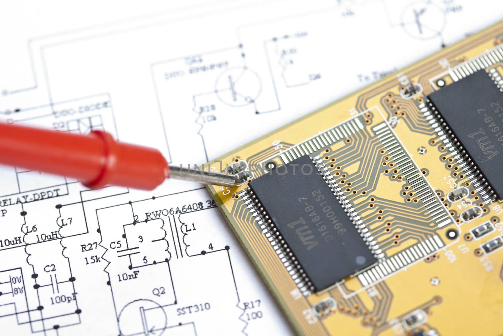 Electronic components on a schematic diagram background.