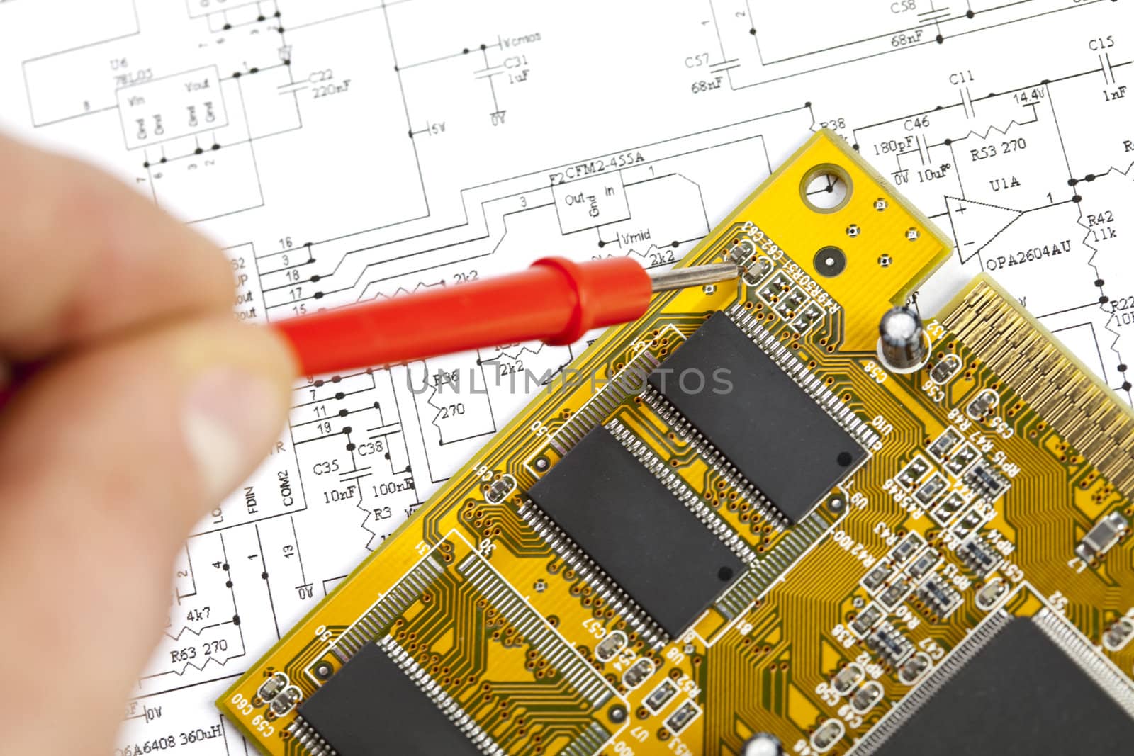 Electronic components on a schematic diagram background.