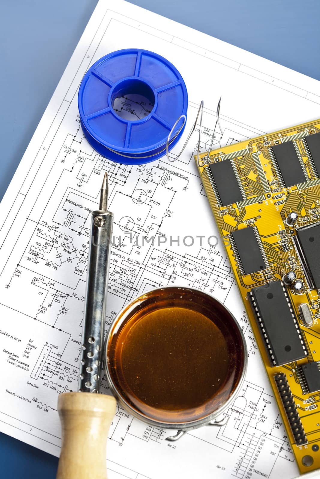 Electronic components on a schematic diagram background.