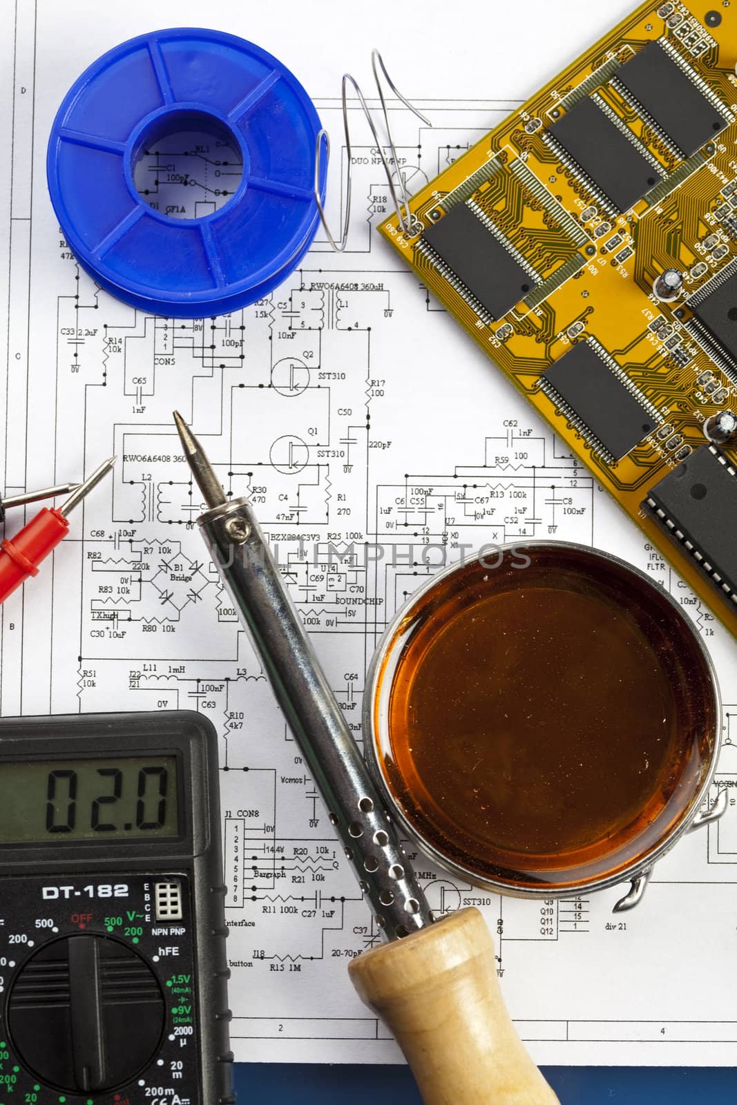 Electronic components on a schematic diagram background.