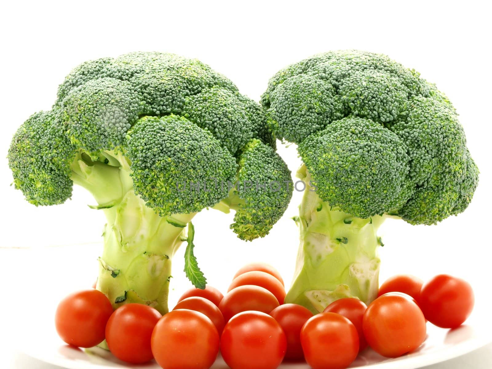 Broccoli and tomato isolated towards white