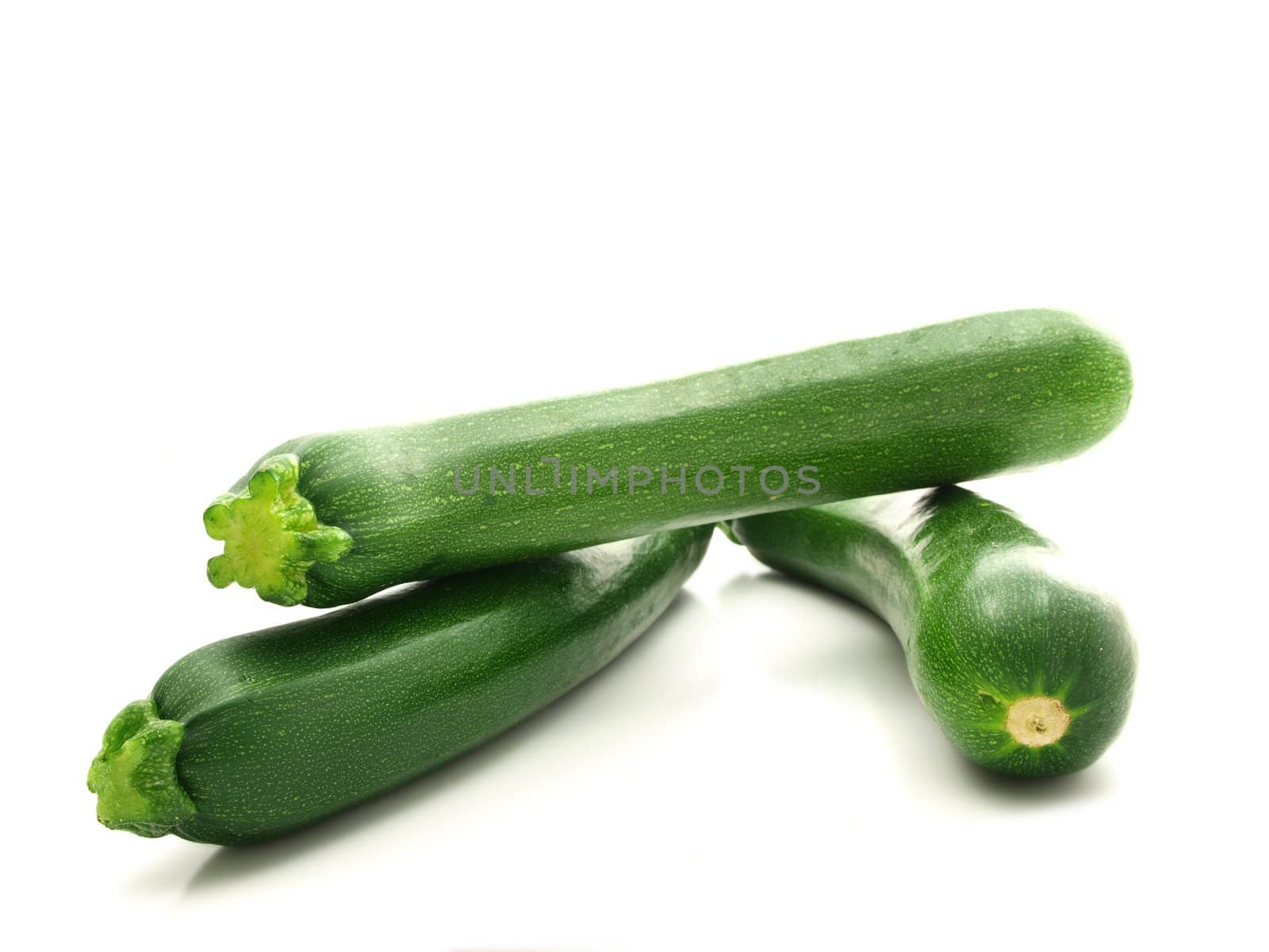 Whole zucchini vegetable isolated towards white background