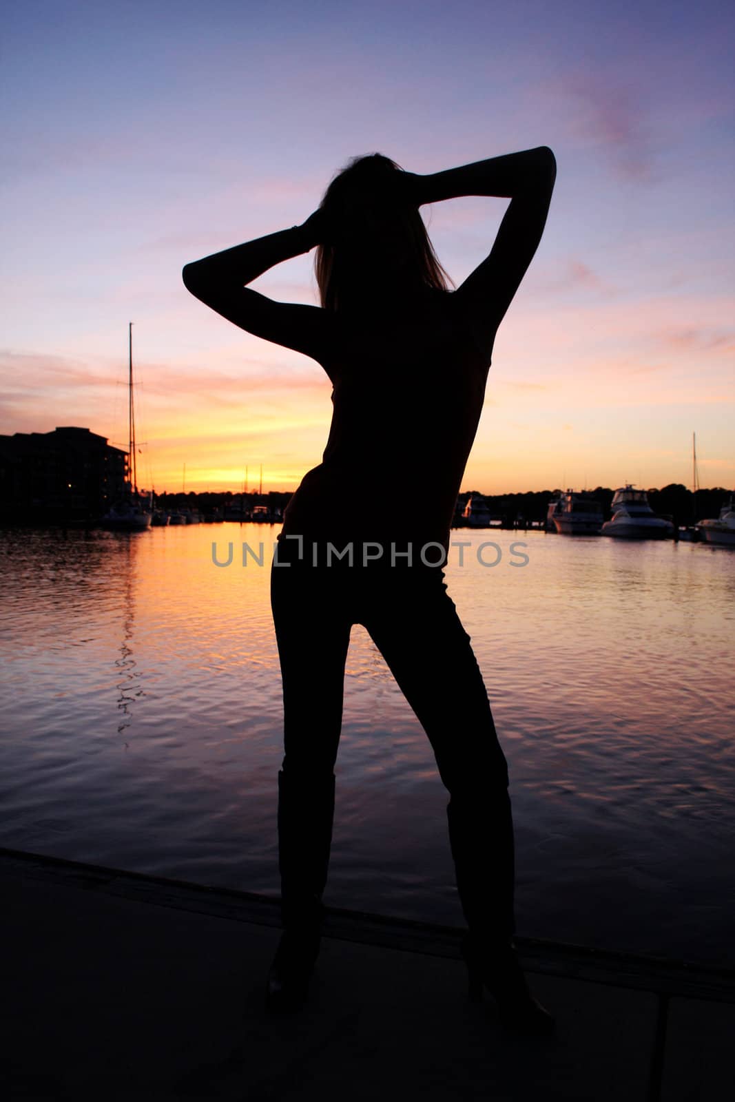 A woman in silhouette during a beautiful sunset