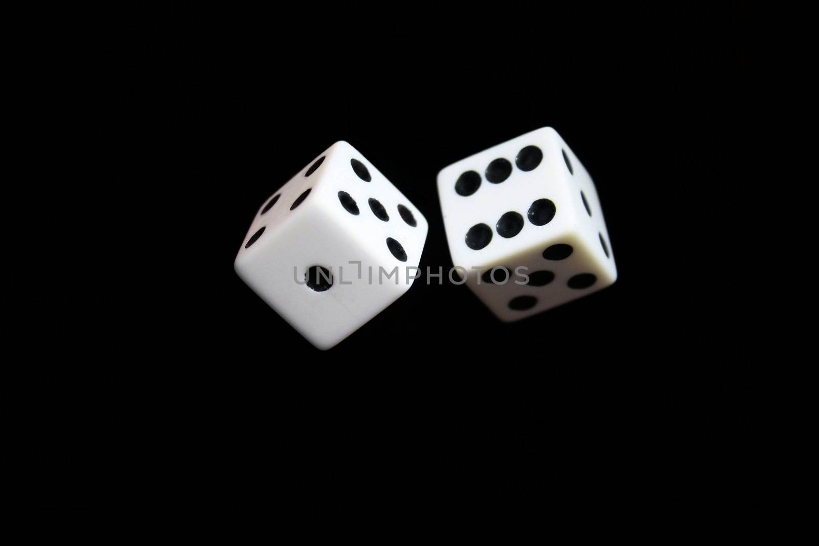 Dice appearing to be thrown in the air