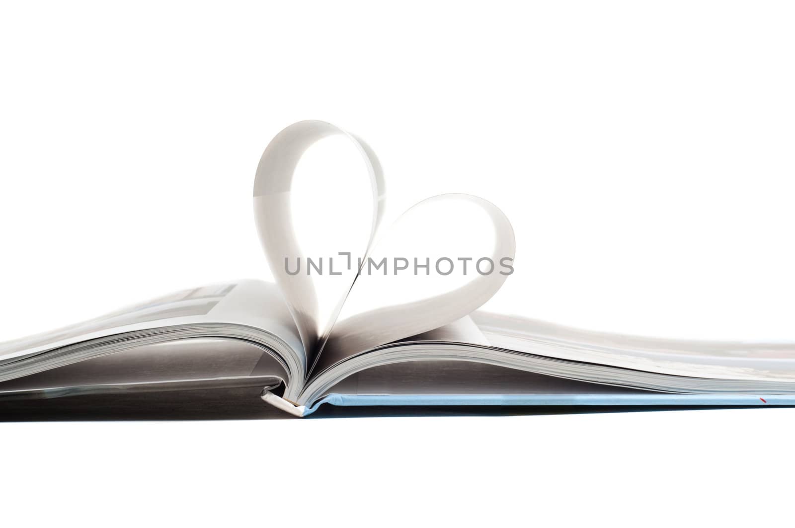 Shot of heart in book, isolated on white