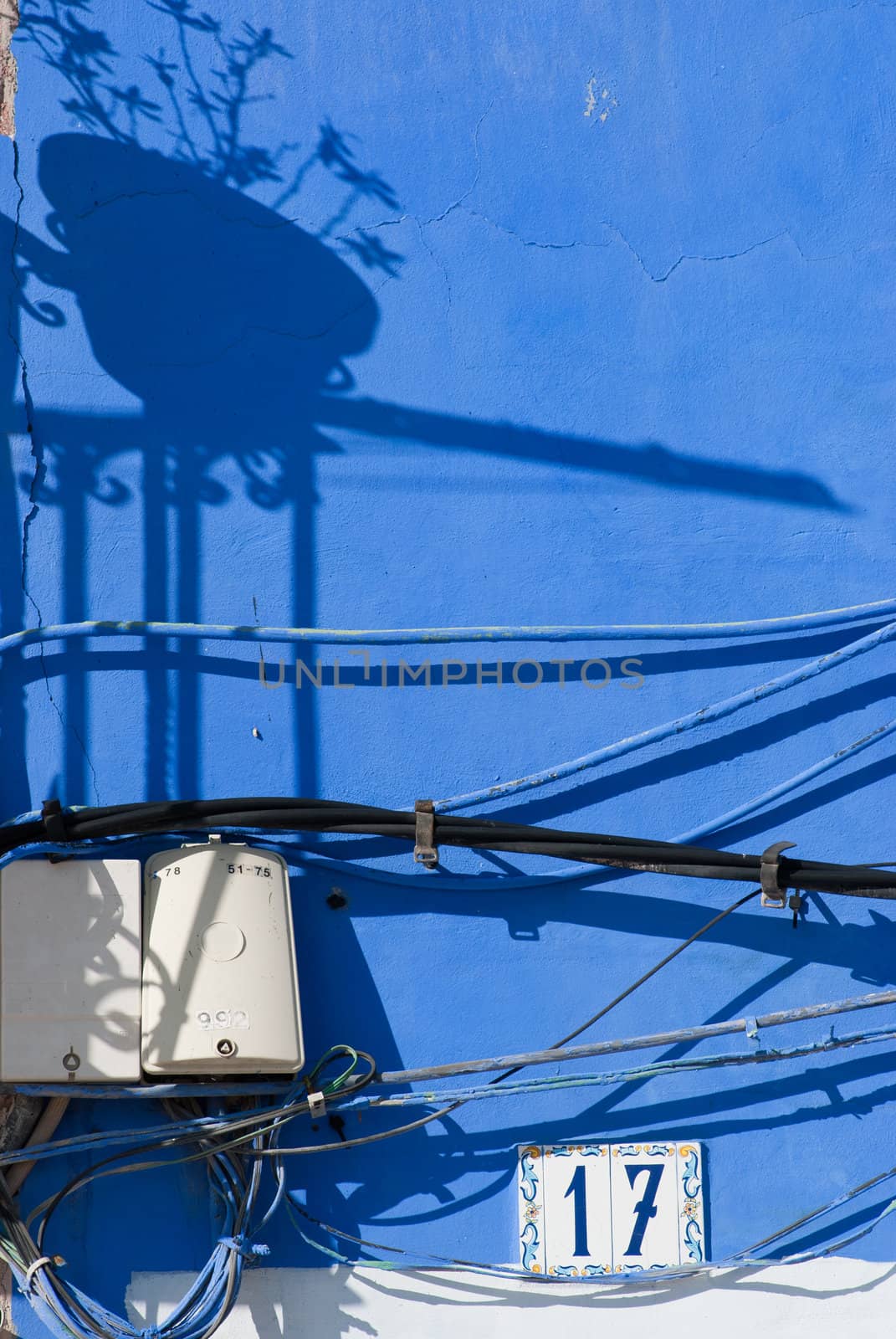 Extremely adventurous power line mess on an old façade