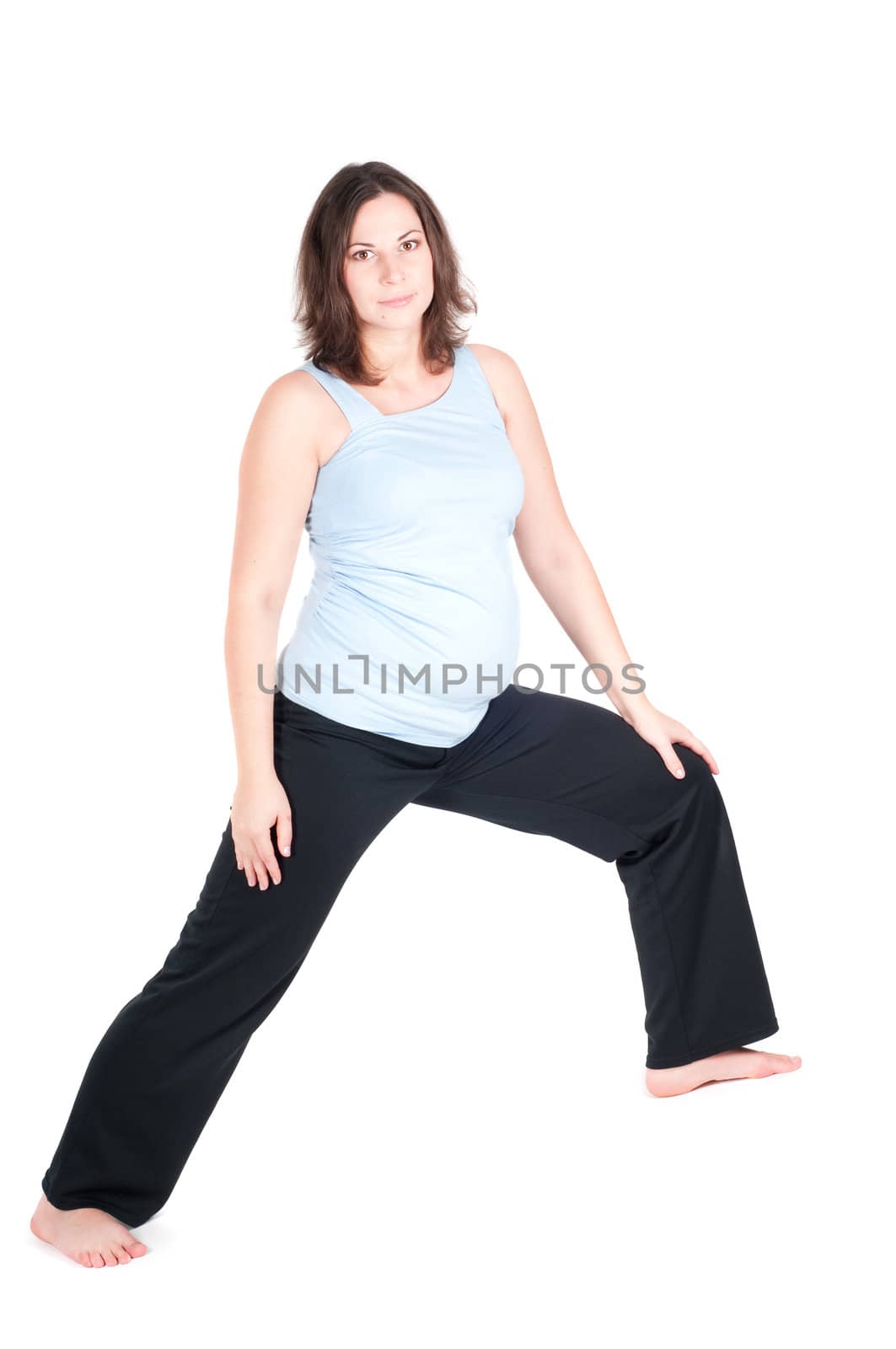 Portrait of pretty pregnant woman practicing yoga by anytka