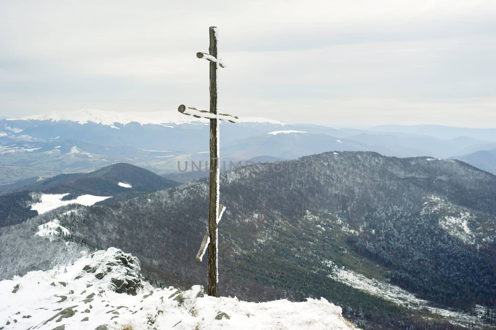 Cross on top of the Carpathian mountain Pikuy. Ukraine