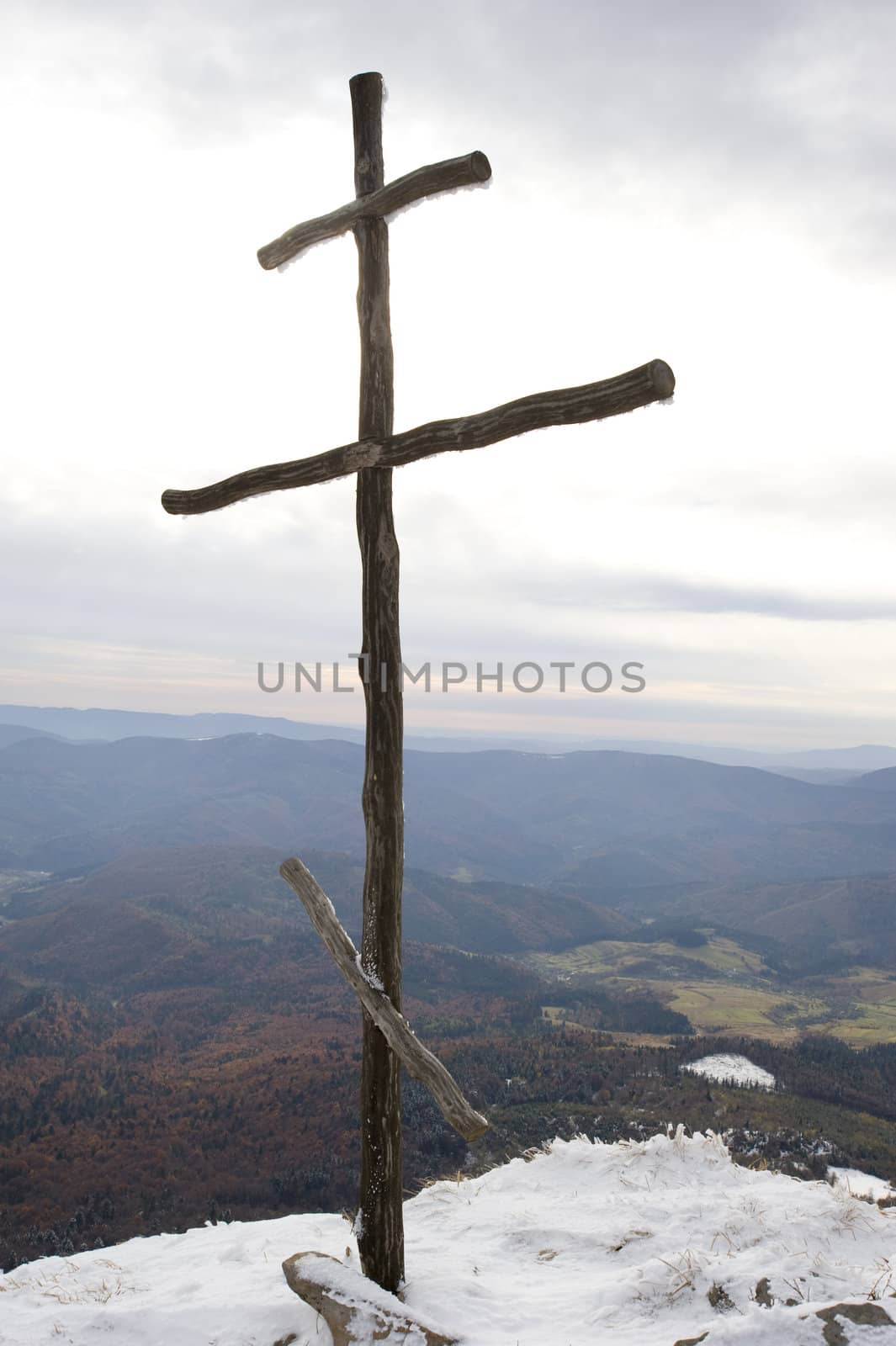 Cross on top of the Carpathian mountain Pikuy. Ukraine