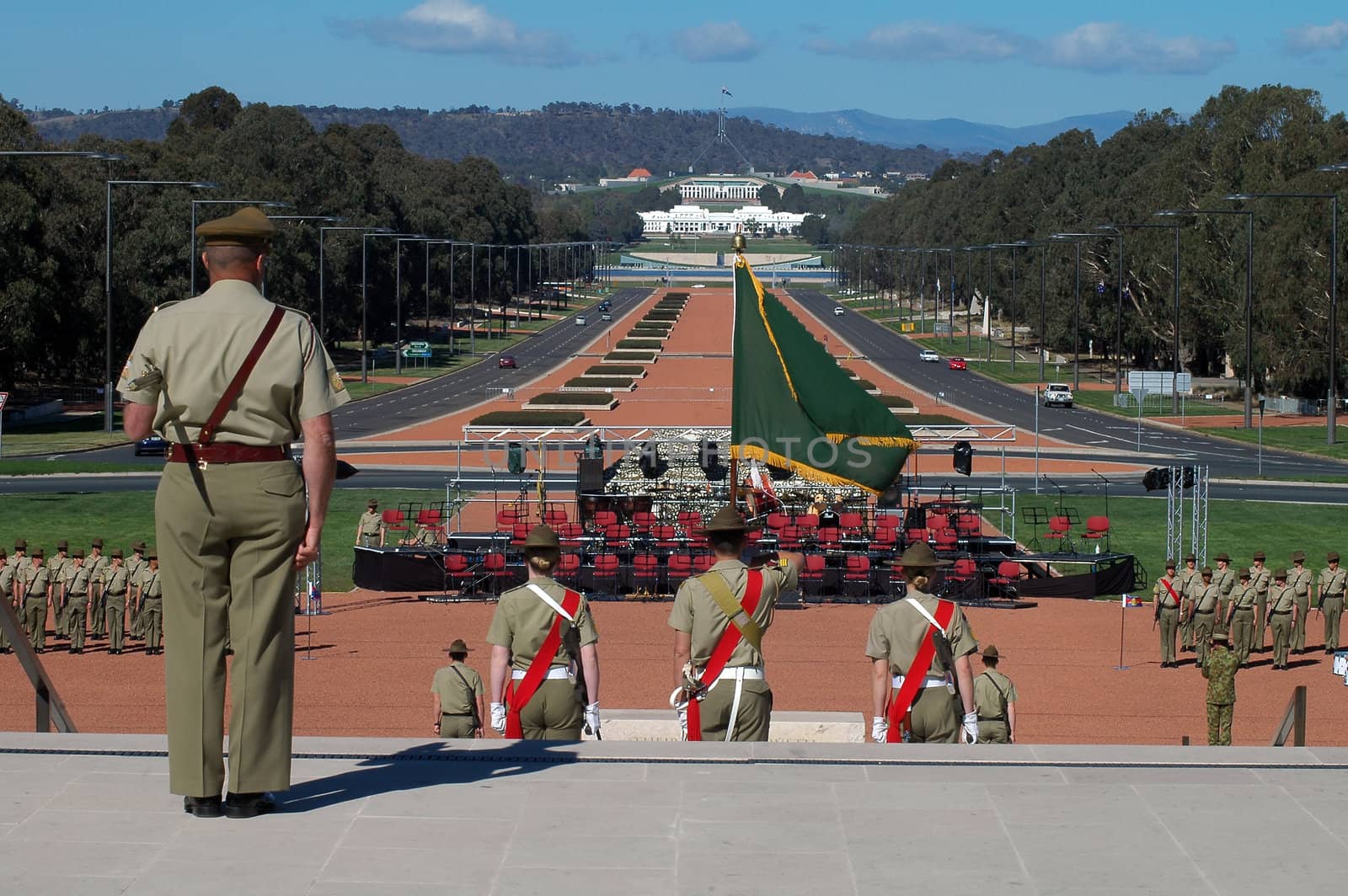 australian soldiers standing in front of australian war museum in Canberra, modern Parliament House in background, Anzac Parade