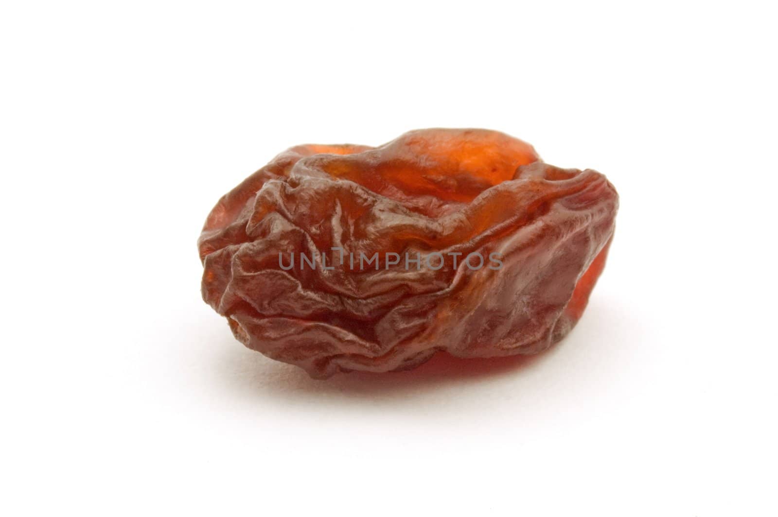 dried brown raisin isolated on white background