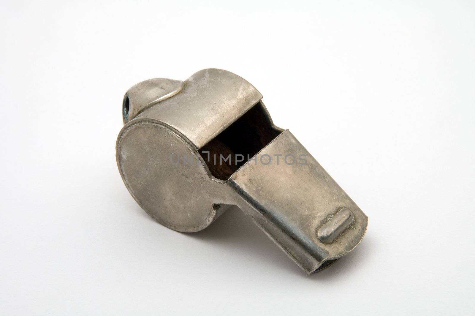 old steel whistle isolated on white background