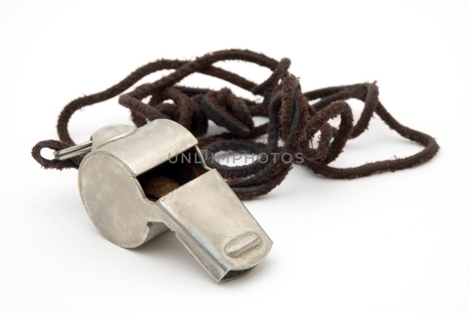 old steel whistle isolated on white background