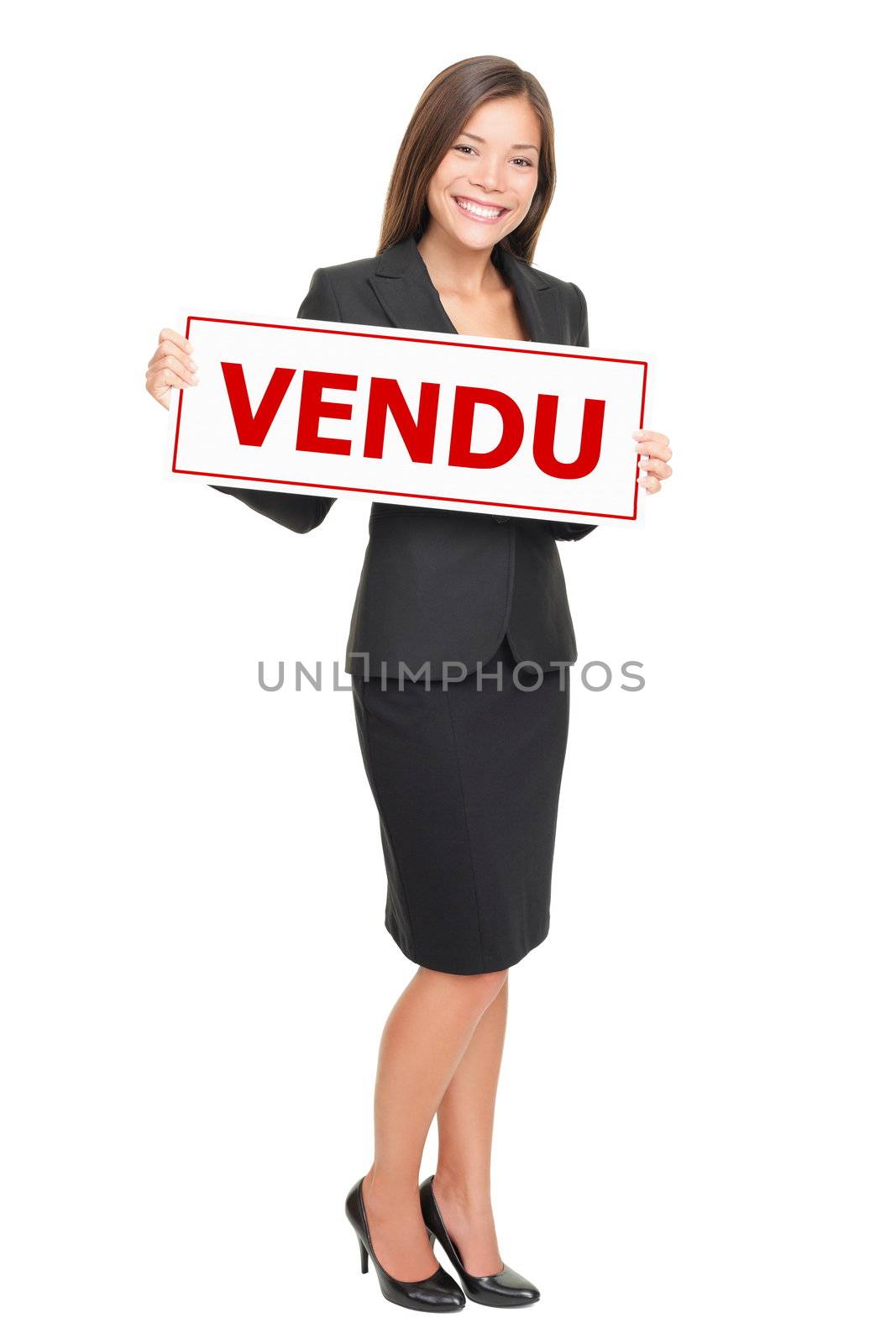 French real estate agent holding french sold sign - agent immobilier avec pancarte vendu