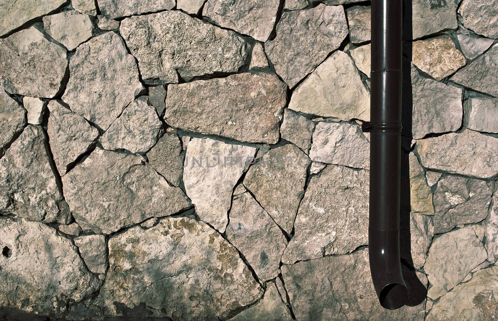 Fragment of a Stone Wall with Downspout.