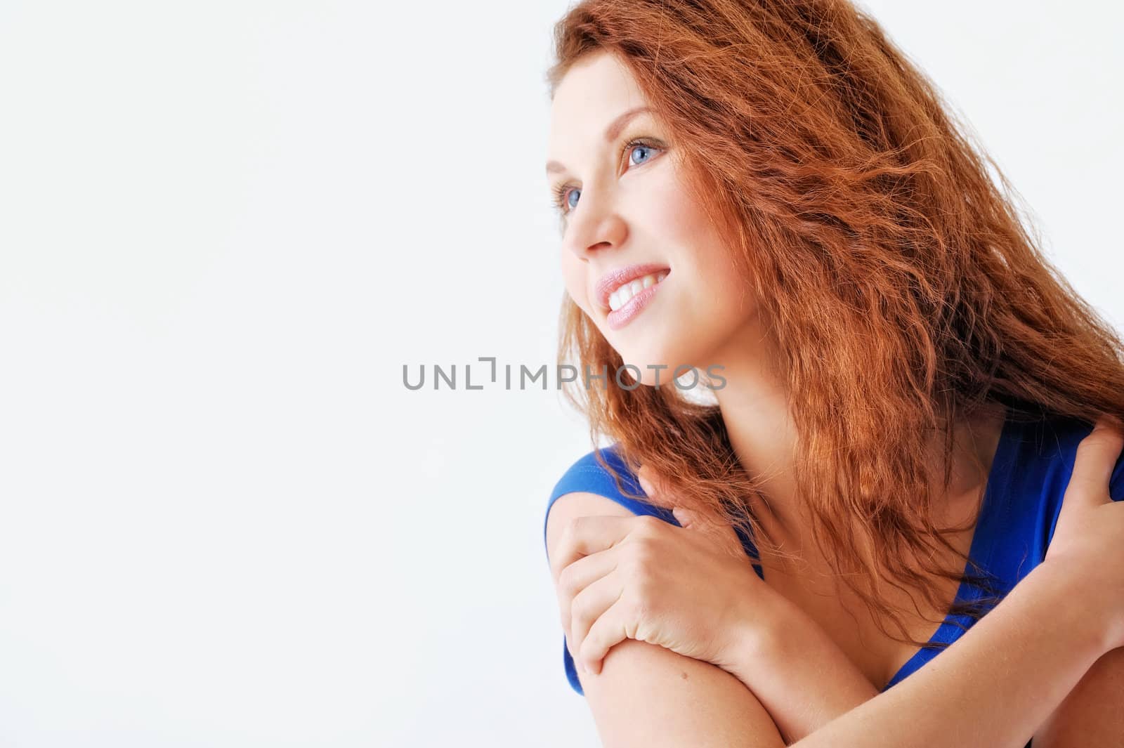 Young smiling woman. Isolated on white background