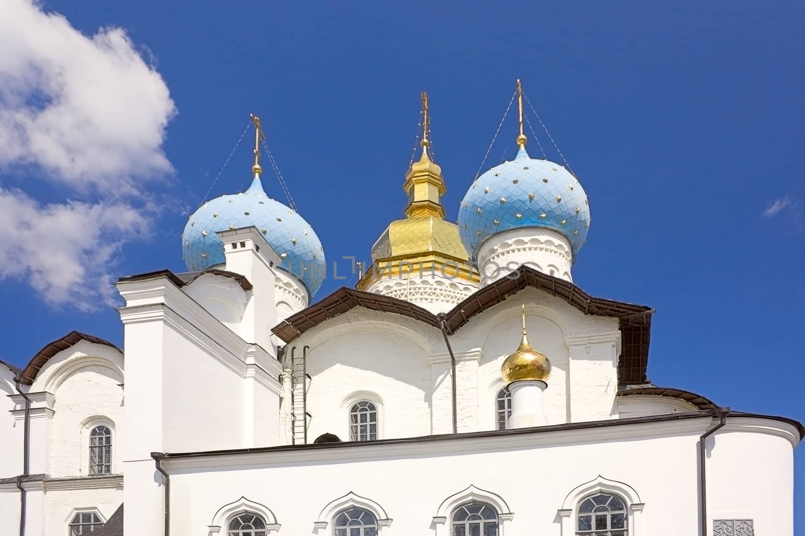 Church with domes against the blue sky, the Kazan Kremlin, Russia.
