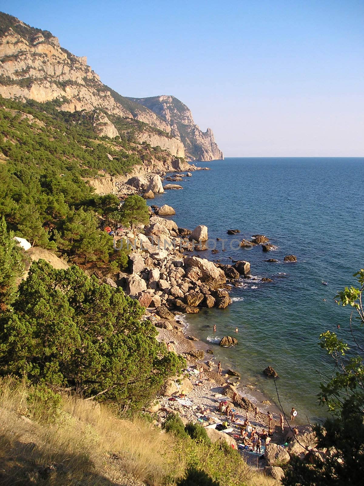 Aya cape is located in the Black sea near Balaklava, not far from Sevastopol. On the shore, strew by stones, they rest and bathe in the sun people. On this sea shore it is good to rest during leave. 
