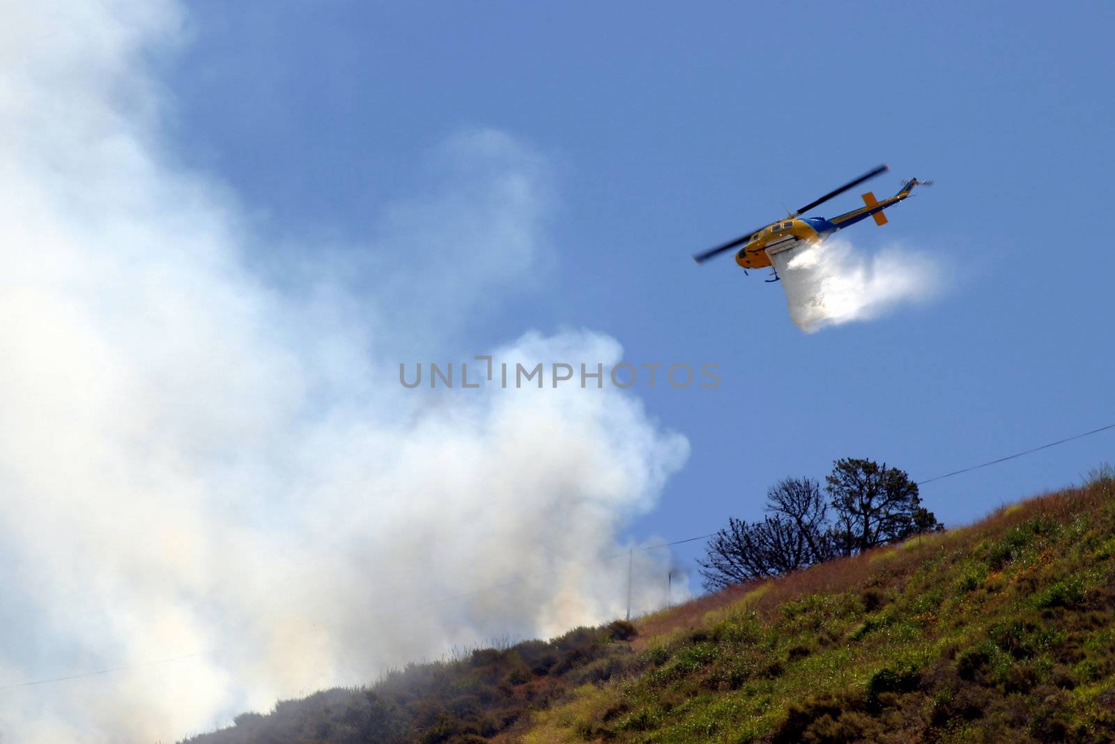 Brush fire in Ventura, California. The fire consumed 25 acres and was quickly controlled by more then 100 firefighters and water dropping helicopters.