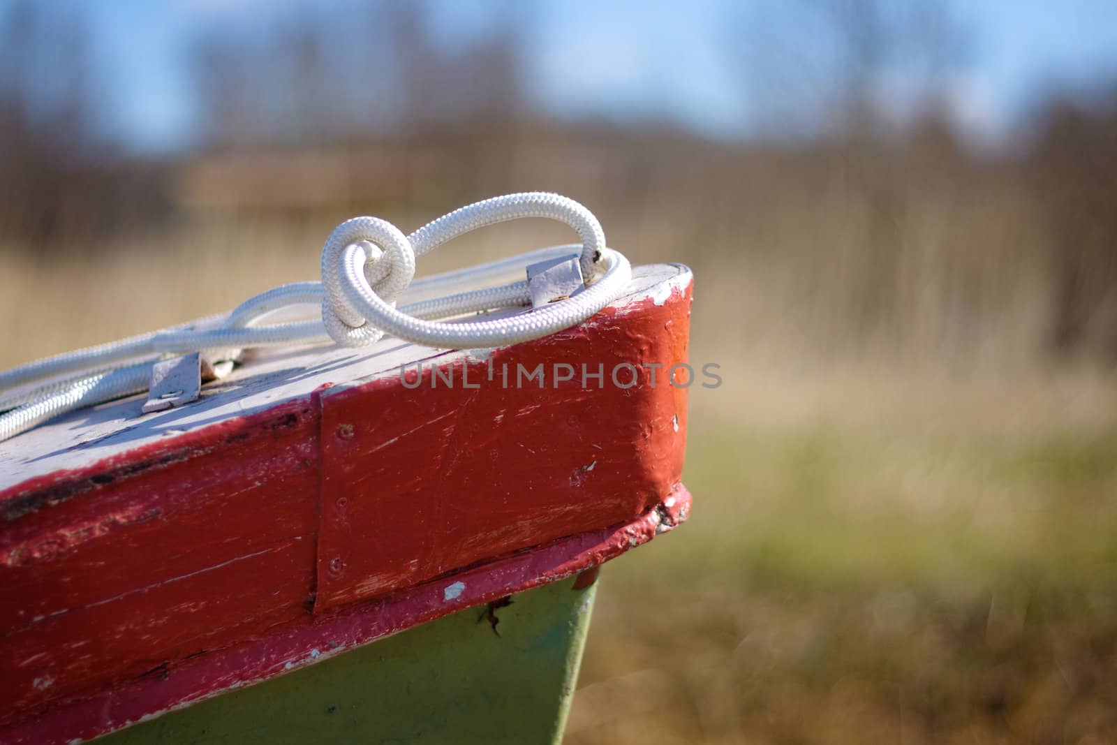 lonely fishing boat on a beach, shallow DOF