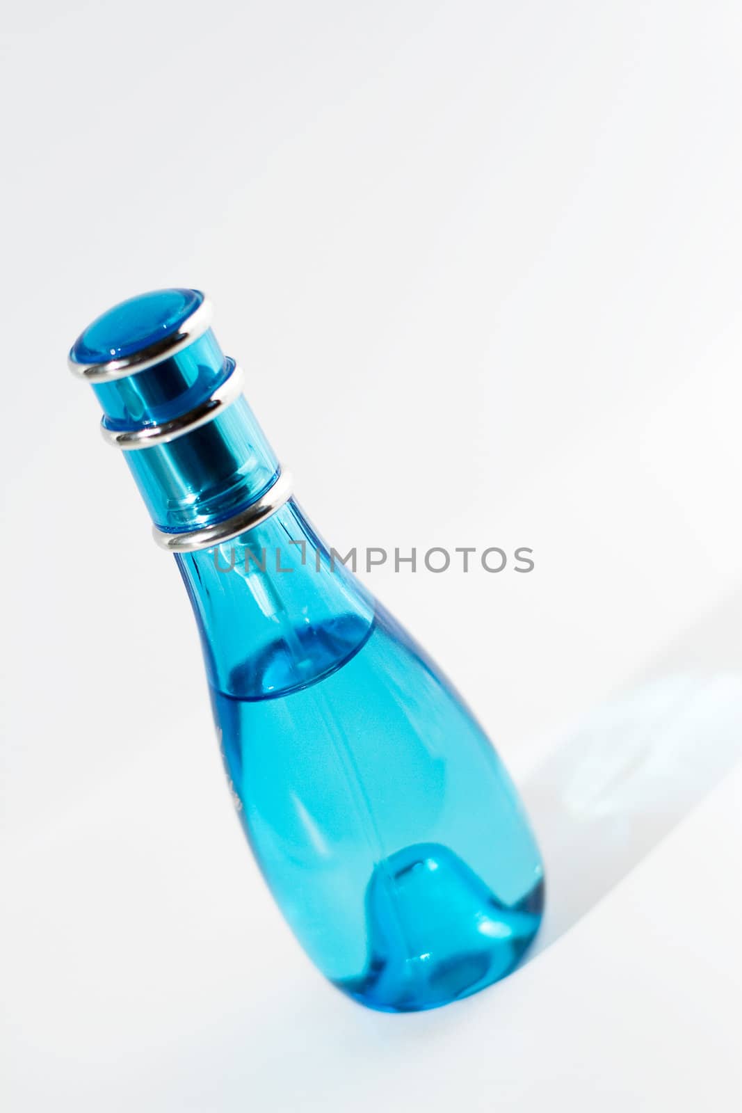 elegant perfume bottle, slanted shot, shallow DOF