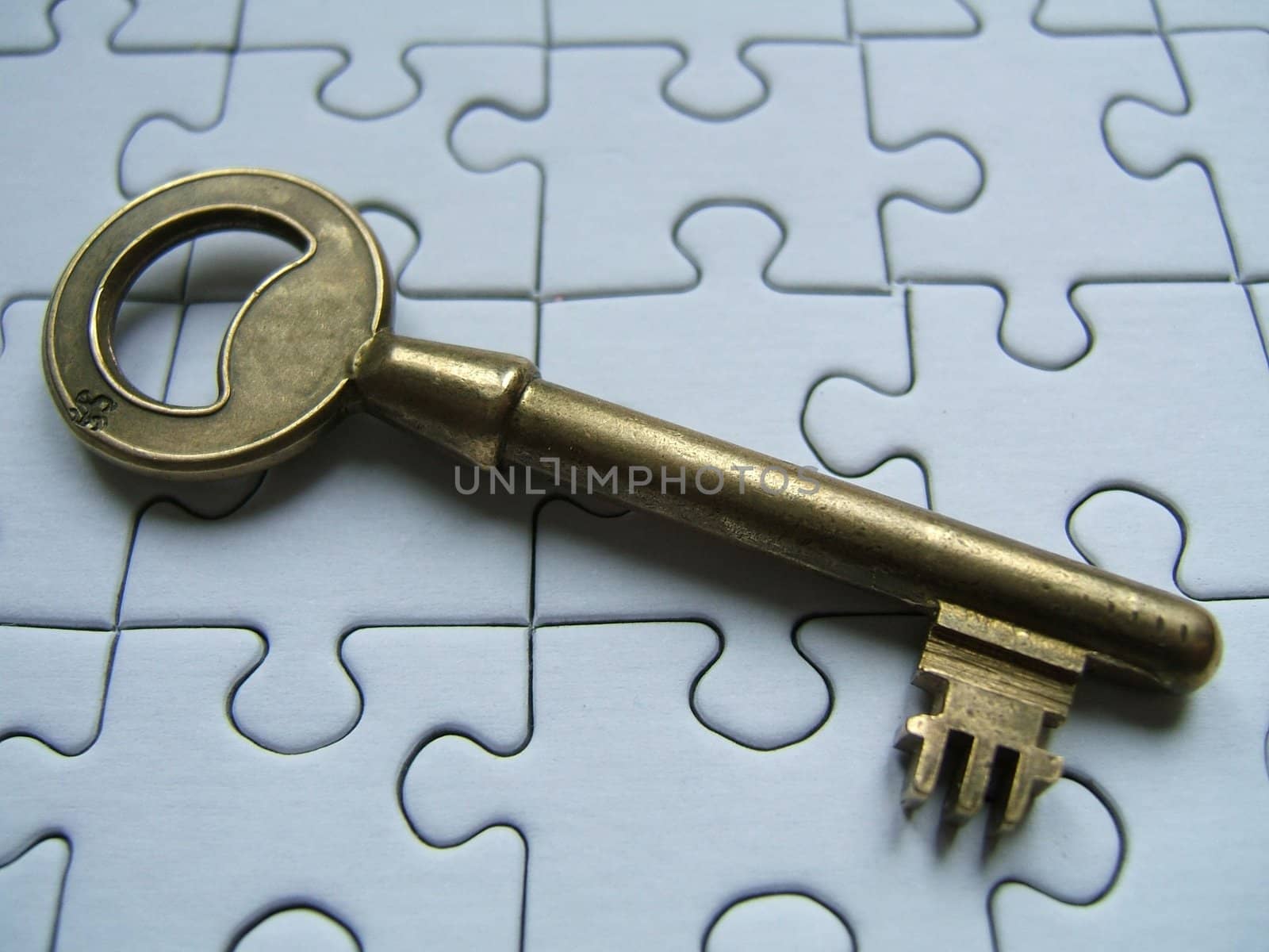 Key on blue jigsaw background