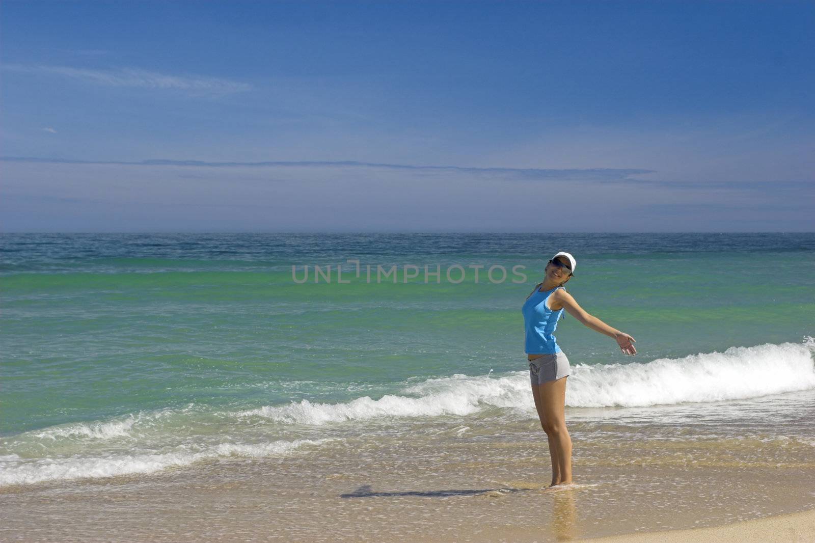 Beautiful woman having fun on the beach 