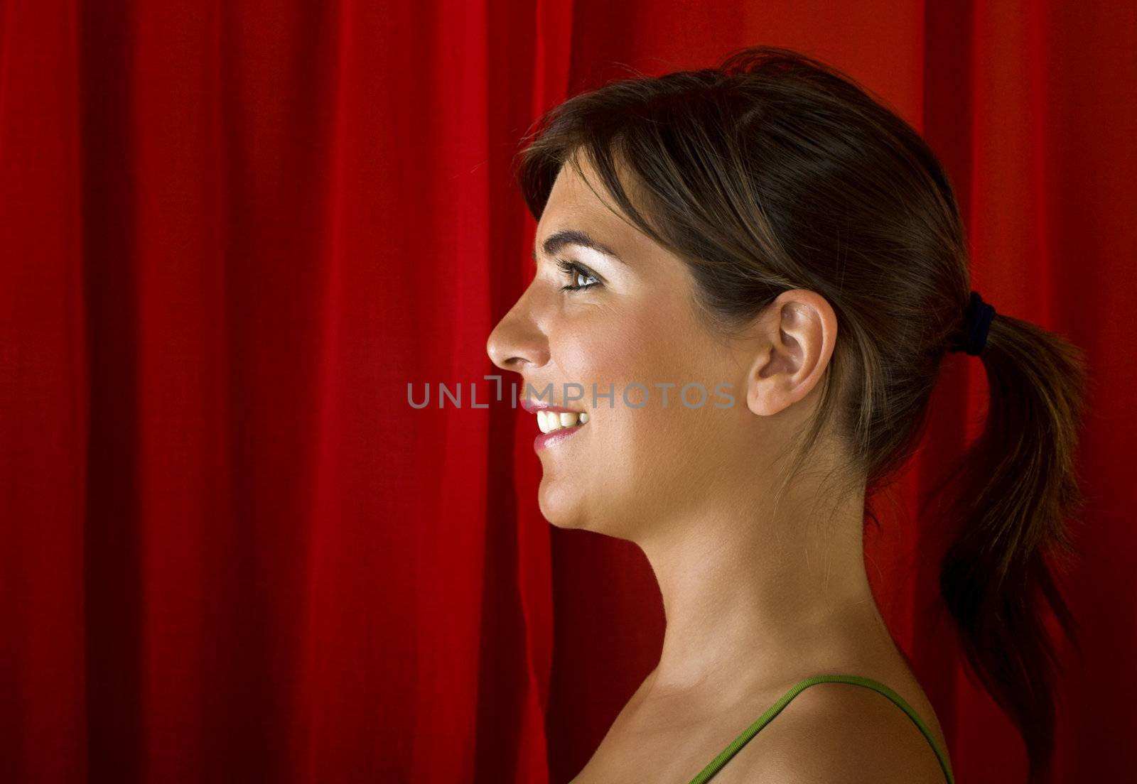 Beautiful young woman portrait on a red background