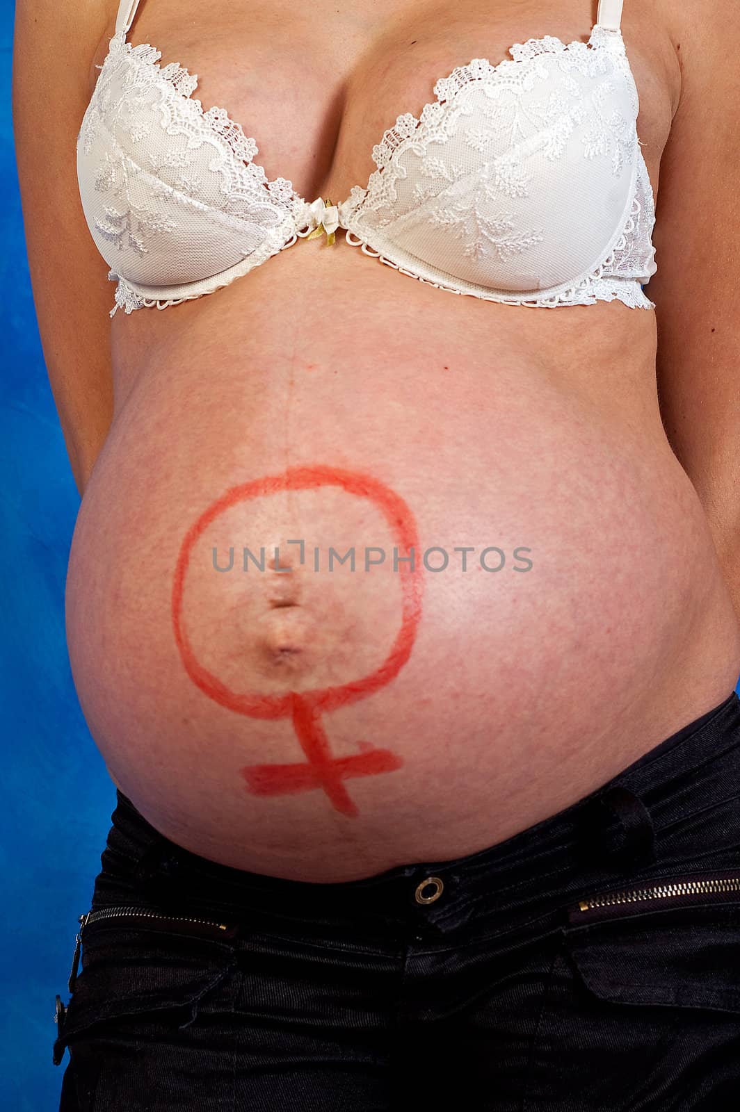 Pregnant woman on the blue mosaic background