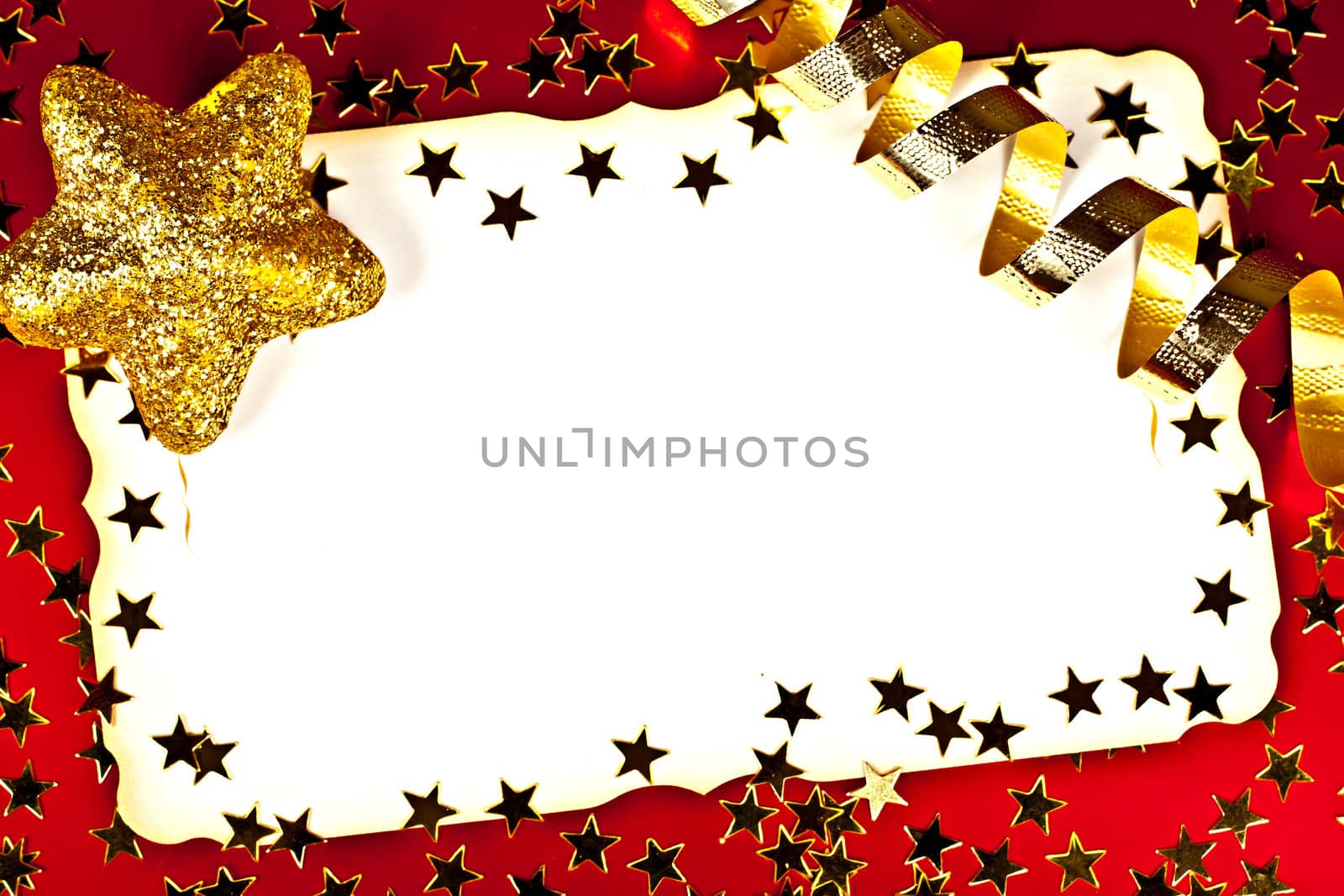 On a red background white greeting card with golden stars.